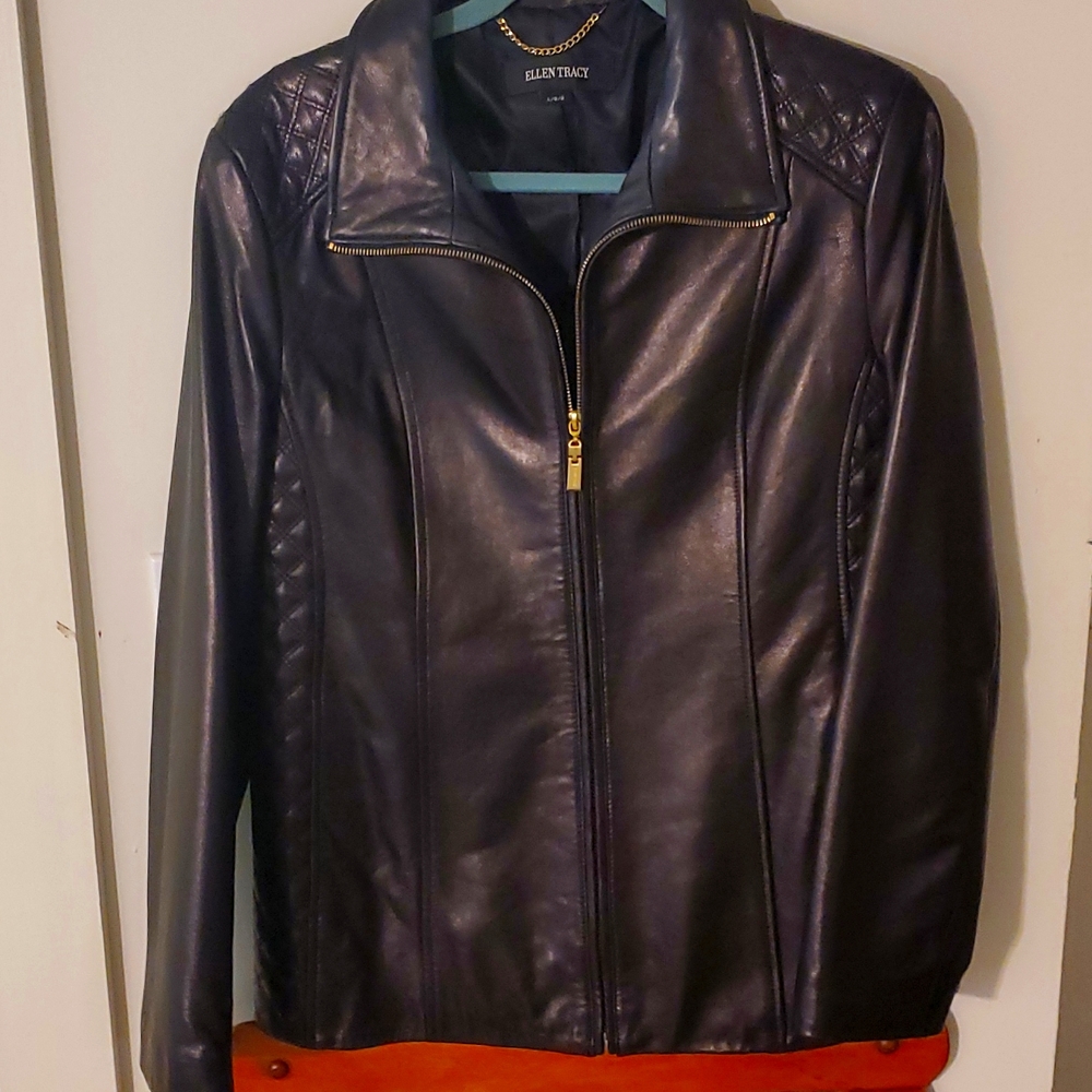 Black leather jacket with gold zipper